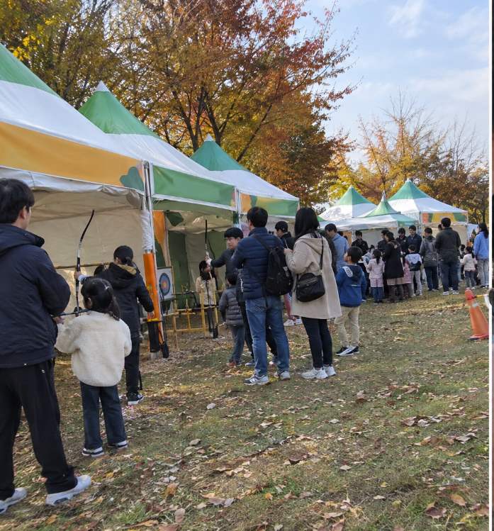 Yecheon Archery Festival family enjoying food truck dishes near Hancheon Sports Park