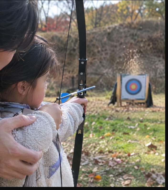 Yecheon Archery Festival visitors shooting at gukgung and Western archery targets at Hancheon Sports Park